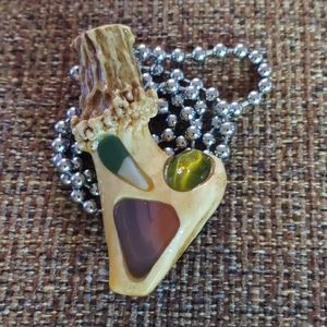 Hand carved deer antler pendant
